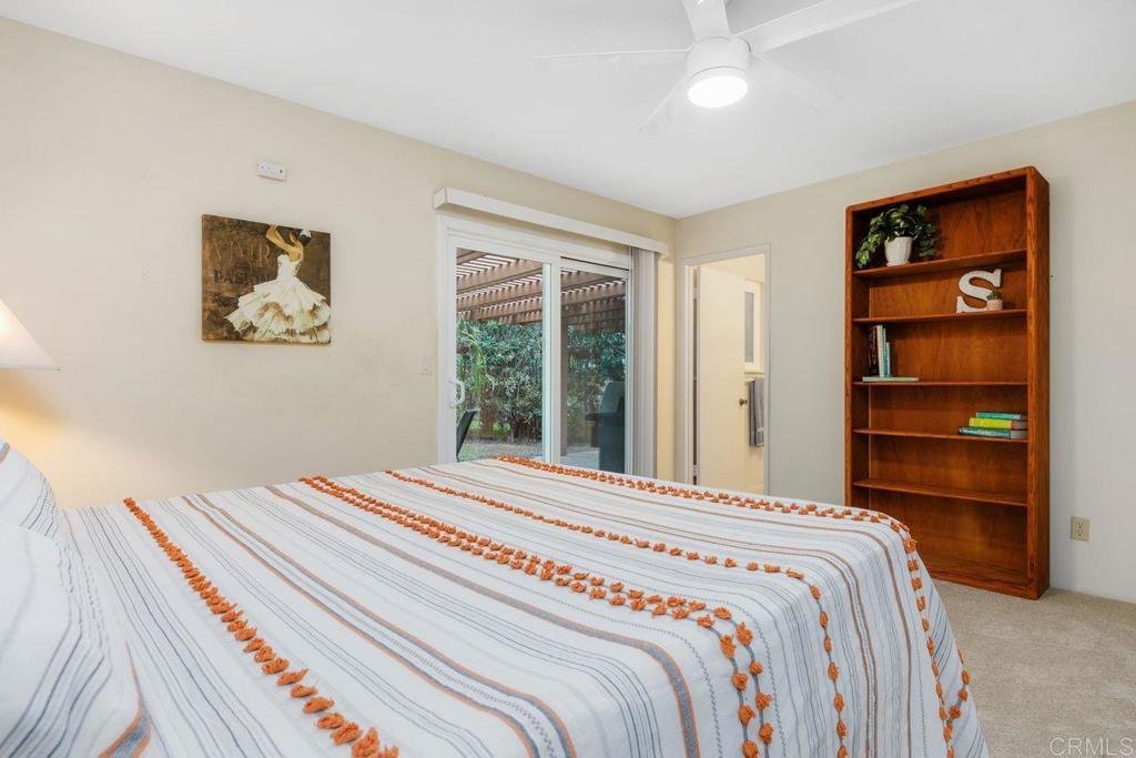 1037 Glenmere Road Vista, CA 92084 - Photo 15 of 36 a bedroom with a bed and a window