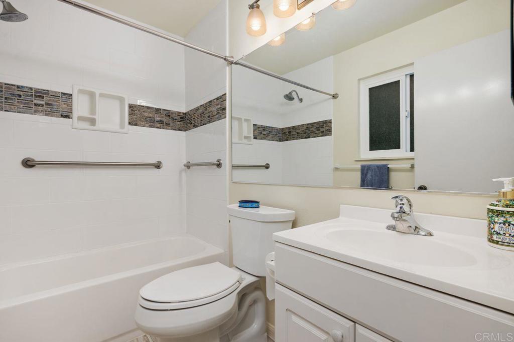 1037 Glenmere Road Vista, CA 92084 - Photo 16 of 36 a bathroom with a sink a toilet and shower