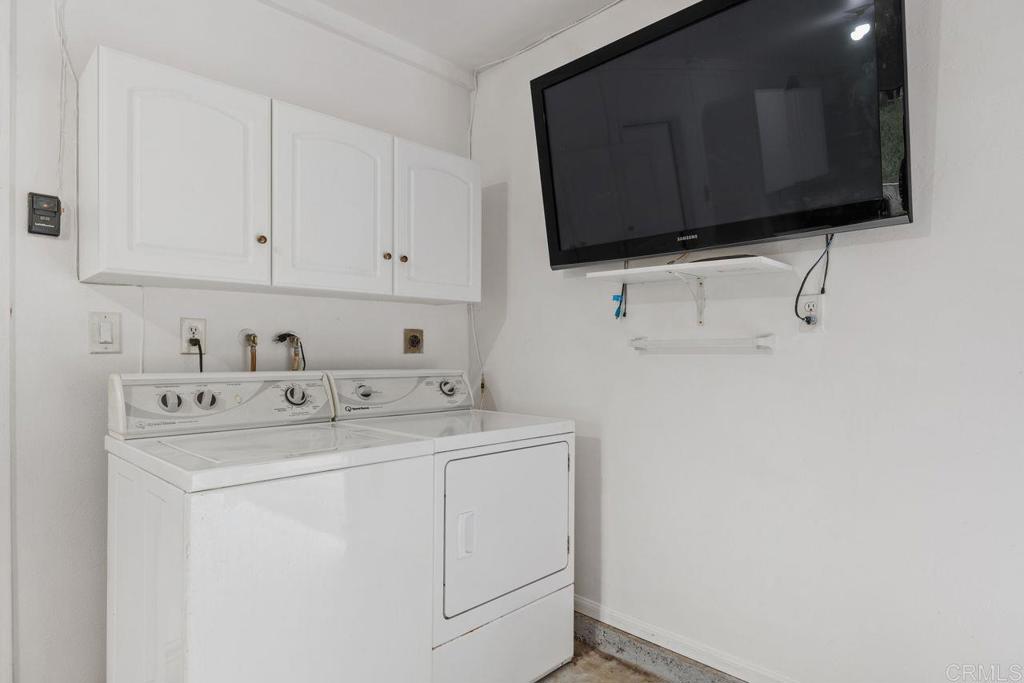 1037 Glenmere Road Vista, CA 92084 - Photo 31 of 36 a utility room with dryer and washer