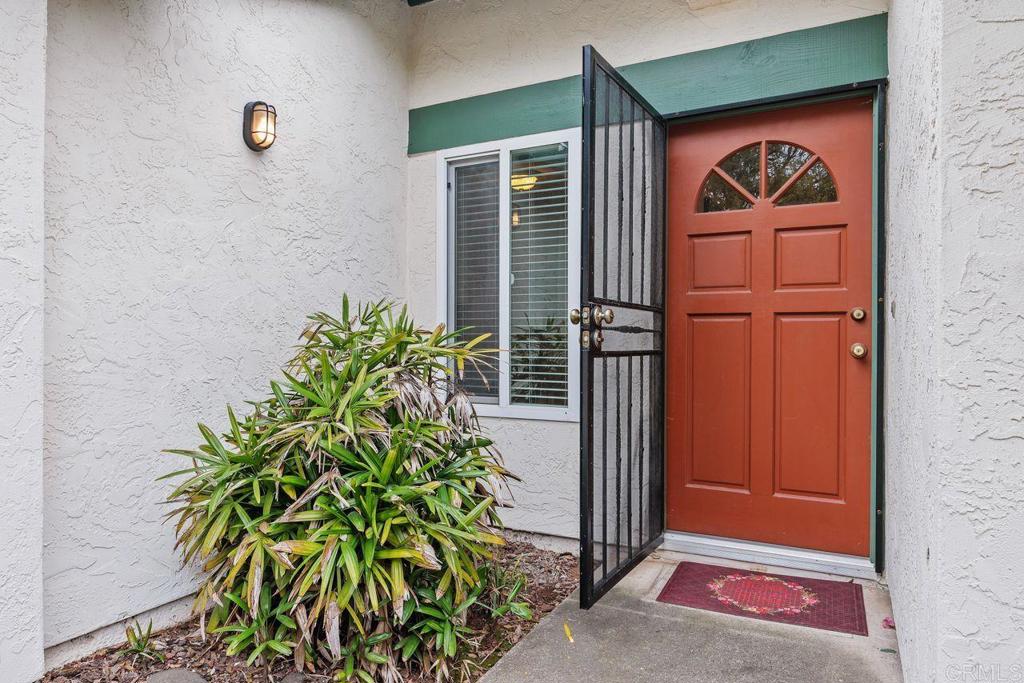 1037 Glenmere Road Vista, CA 92084 - Photo 34 of 36 a front view of a house with a yard