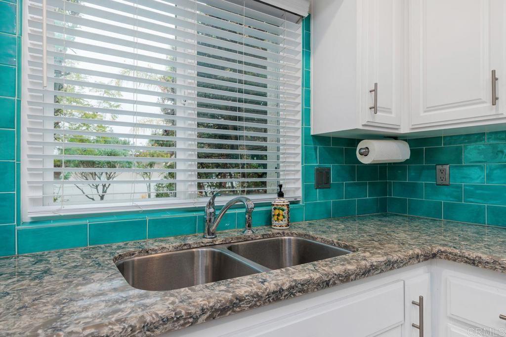 1037 Glenmere Road Vista, CA 92084 - Photo 8 of 36 a kitchen with a sink and a window