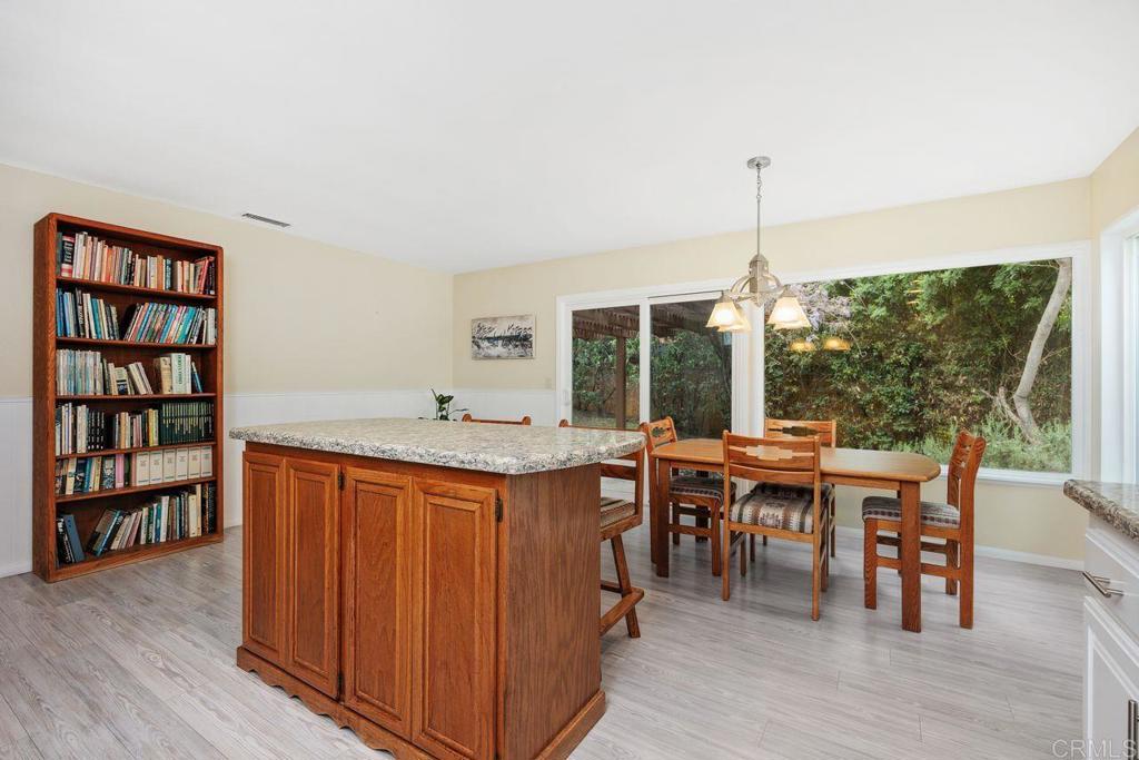 1037 Glenmere Road Vista, CA 92084 - Photo 10 of 36 a view of a dining room with furniture window and wooden floor