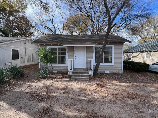 a house with trees in front of it