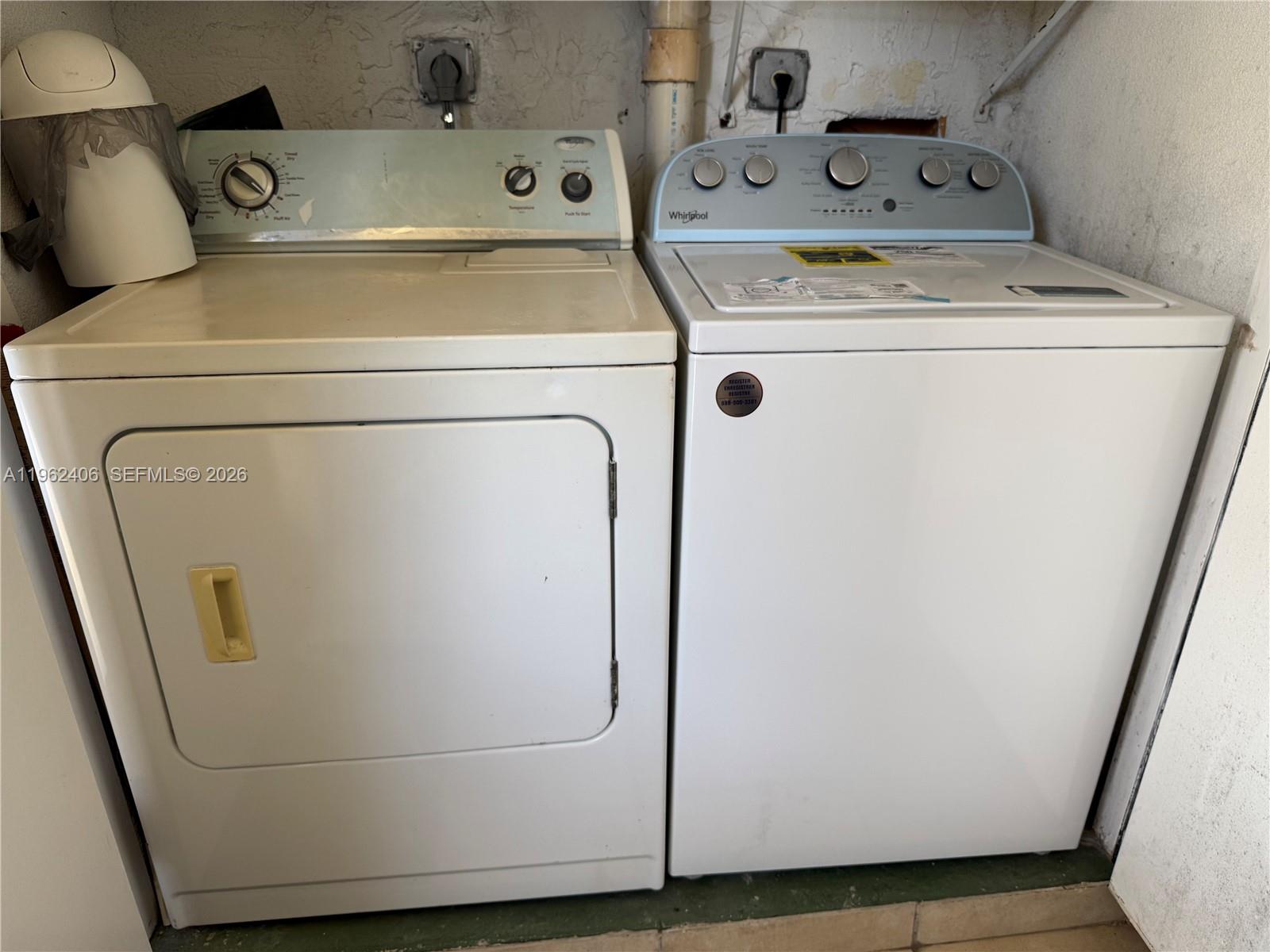 351 Club Circle, Unit 102 Boca Raton, FL 33487 - Photo 28 of 34 a utility room with dryer and washer
