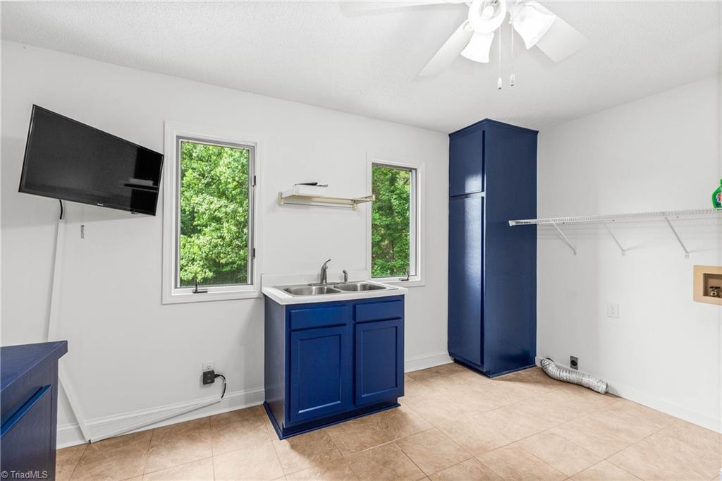 4200 Clinard Road Clemmons, NC 27012 - Photo 27 of 49 View of laundry room with storage and shelving.