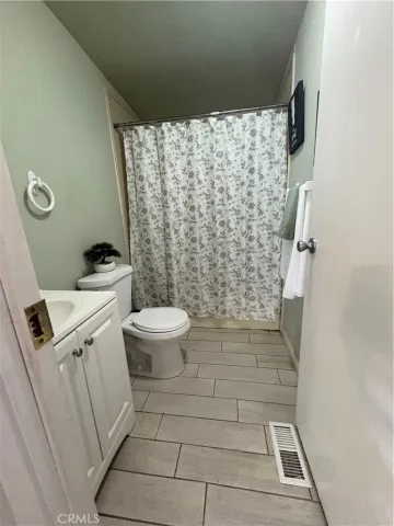 a kitchen with a table and chairs