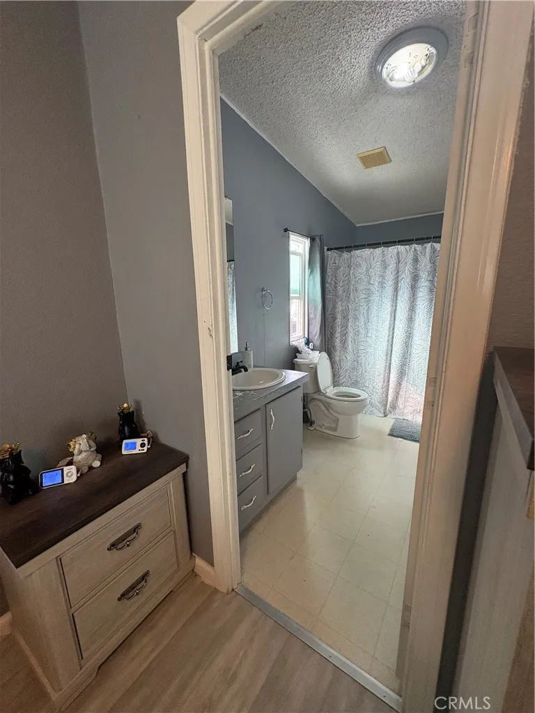 3825 Crestmore Road, Unit 414 Riverside, CA 92501 - Photo 10 of 24 a view of a hallway and a livingroom with furniture