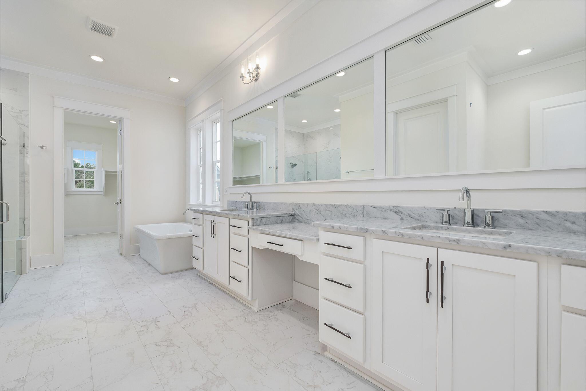 235 Needle Cast Ln Inlet Beach Inlet Beach, FL 32461 - Photo 19 of 58 a bathroom with a granite countertop sink mirror and toilet