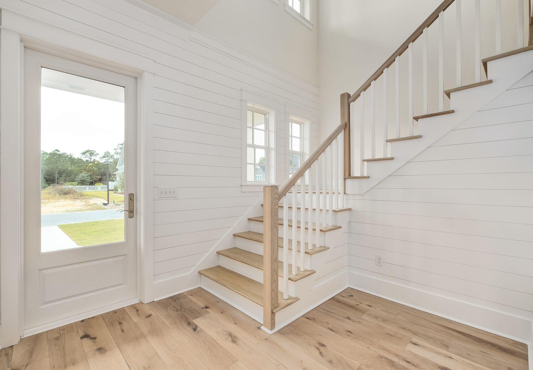 235 Needle Cast Ln Inlet Beach Inlet Beach, FL 32461 - Photo 25 of 58 a view of entryway with wooden floor and front door