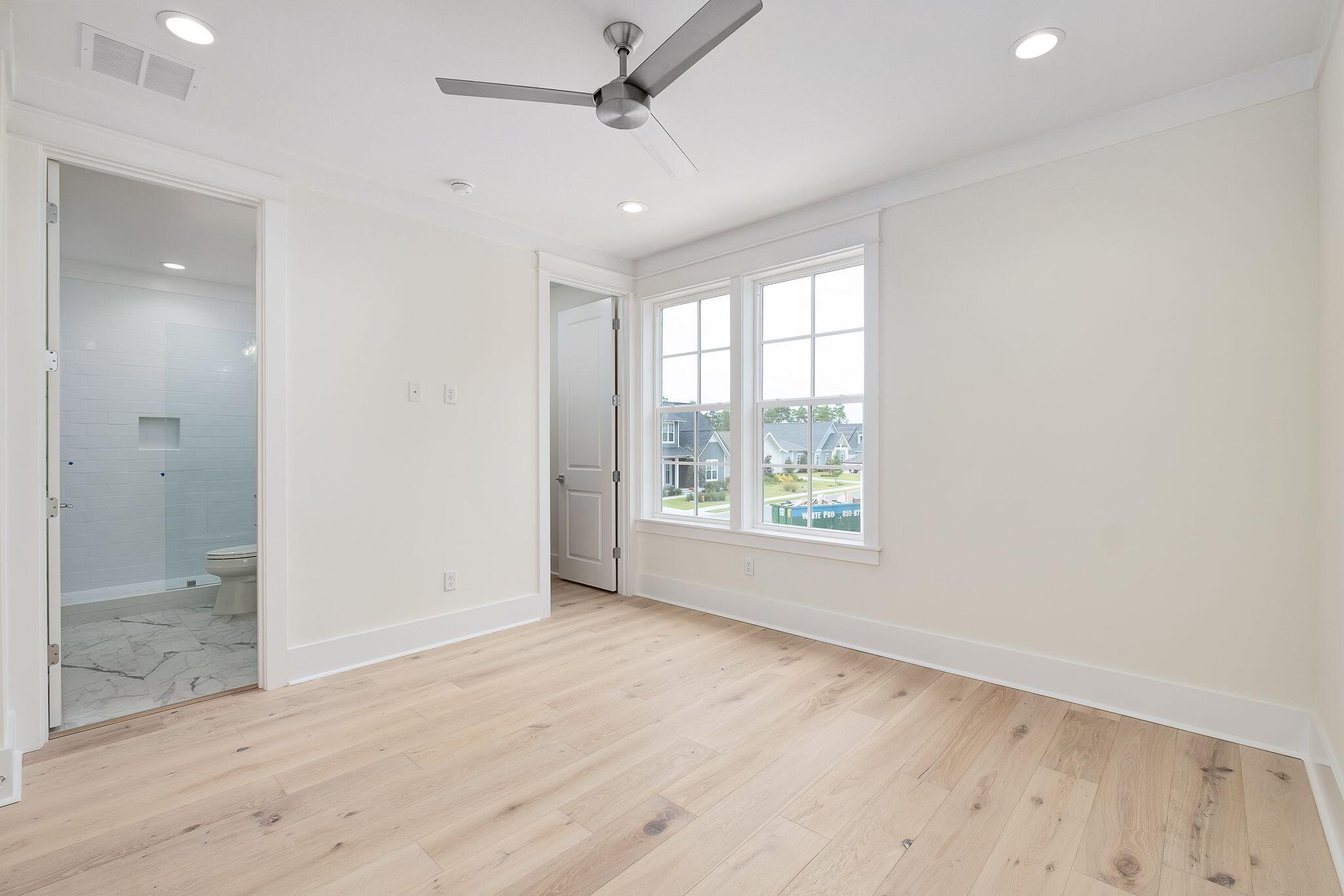 235 Needle Cast Ln Inlet Beach Inlet Beach, FL 32461 - Photo 28 of 58 a view of an empty room with glass door and a window