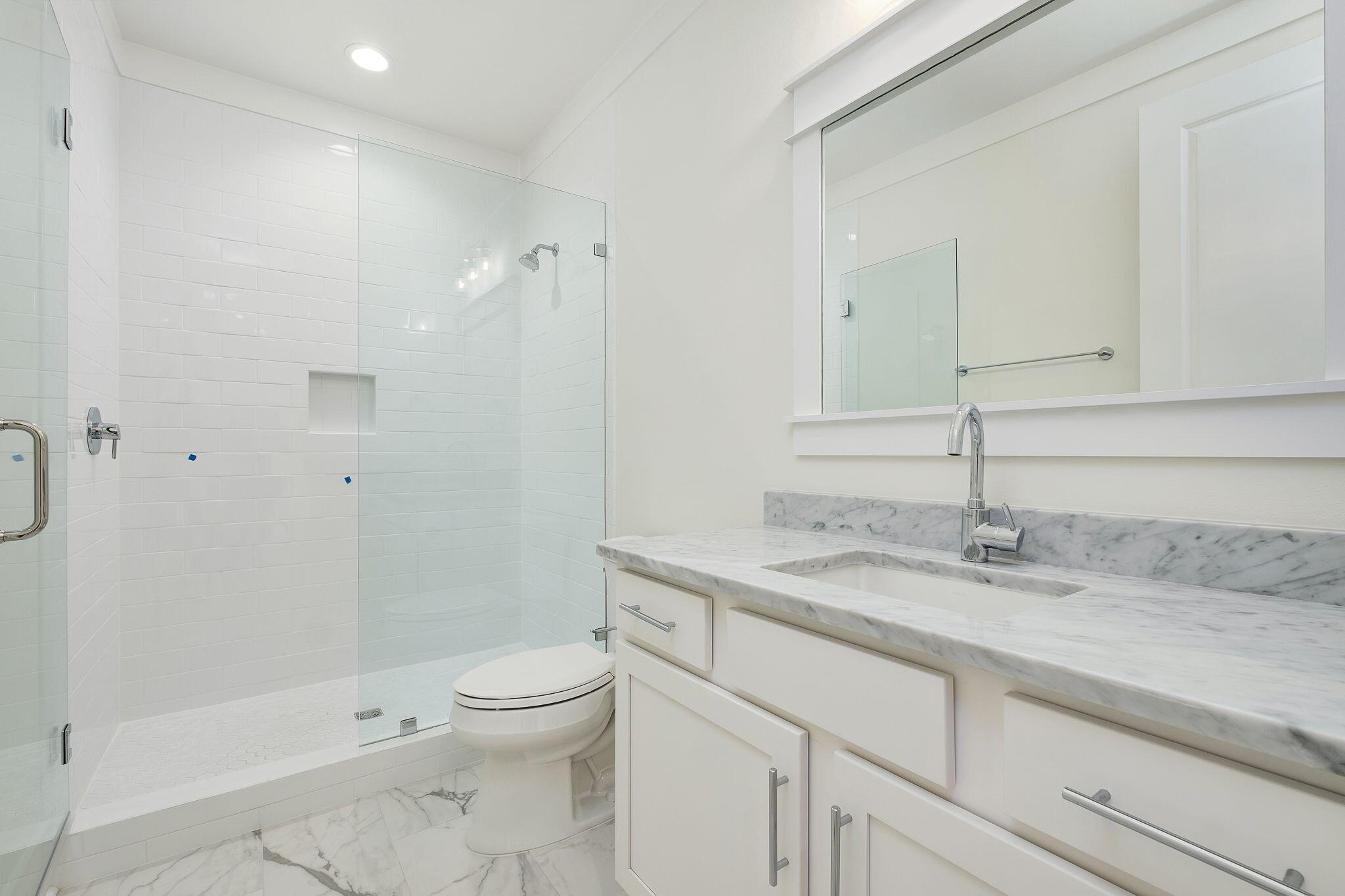 235 Needle Cast Ln Inlet Beach Inlet Beach, FL 32461 - Photo 29 of 58 a bathroom with a granite countertop sink a toilet and shower