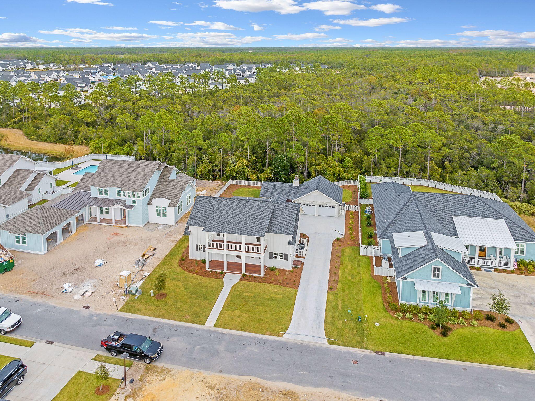 235 Needle Cast Ln Inlet Beach Inlet Beach, FL 32461 - Photo 46 of 58 an aerial view of residential houses with outdoor space and swimming pool