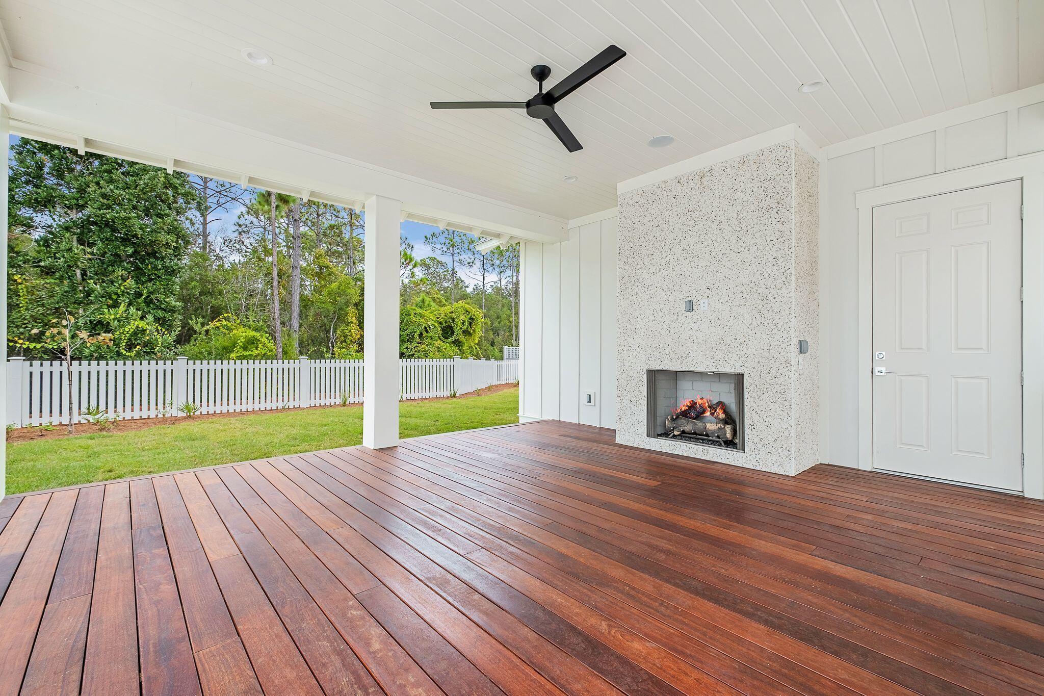 235 Needle Cast Ln Inlet Beach Inlet Beach, FL 32461 - Photo 6 of 58 a view of empty room with wooden floor and fireplace