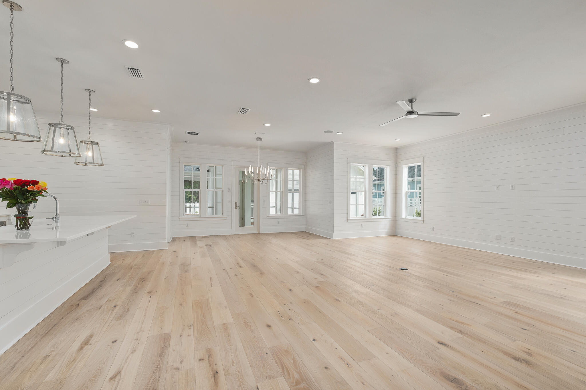 235 Needle Cast Ln Inlet Beach Inlet Beach, FL 32461 - Photo 9 of 58 an empty room with wooden floor and windows