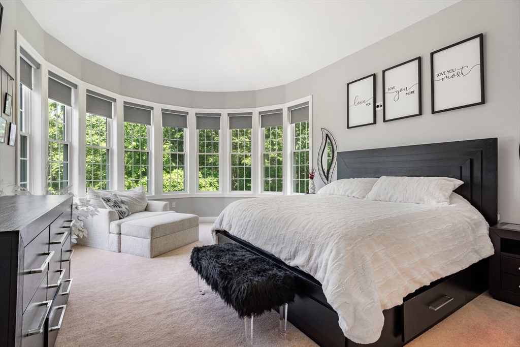 31 Cedar Street North Reading, MA 01864 - Photo 16 of 41 a bedroom with a large bed and a large window