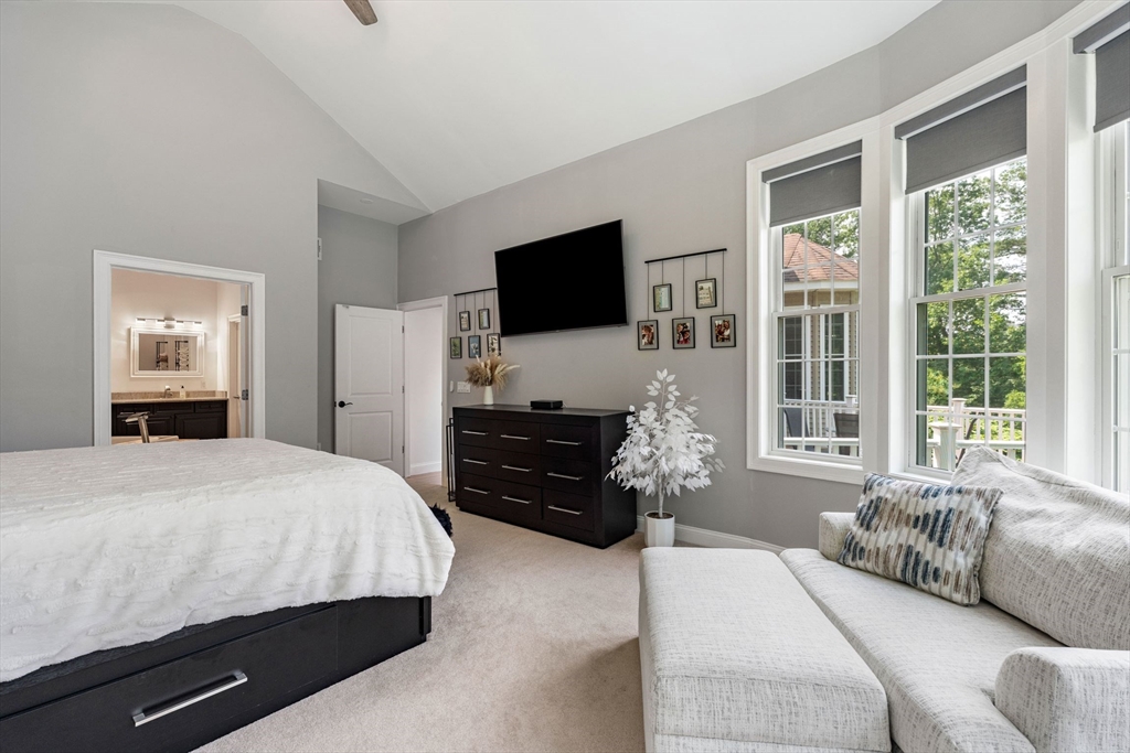 31 Cedar Street North Reading, MA 01864 - Photo 18 of 41 a bedroom with a bed and a flat screen television