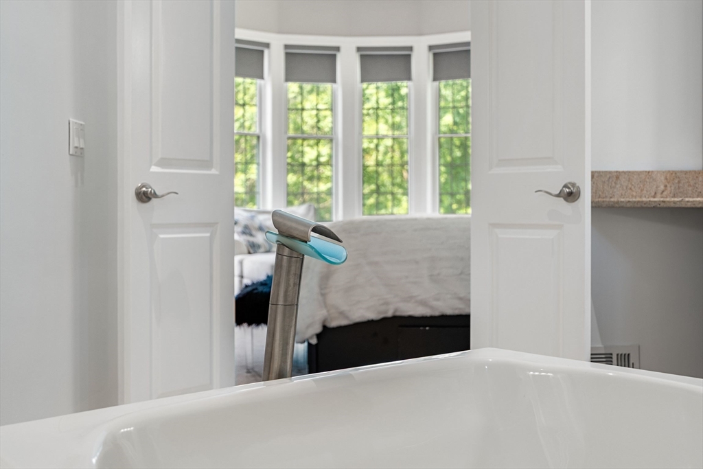 31 Cedar Street North Reading, MA 01864 - Photo 20 of 41 a bedroom with a bed and a fireplace