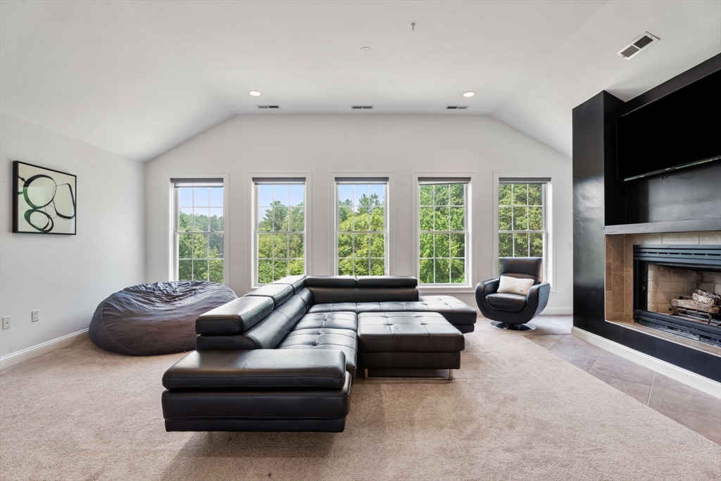 31 Cedar Street North Reading, MA 01864 - Photo 26 of 41 a living room with furniture and a fireplace