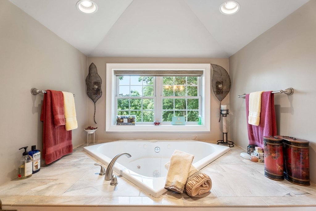31 Cedar Street North Reading, MA 01864 - Photo 41 of 41 a living room with a bed furniture and a flat screen tv