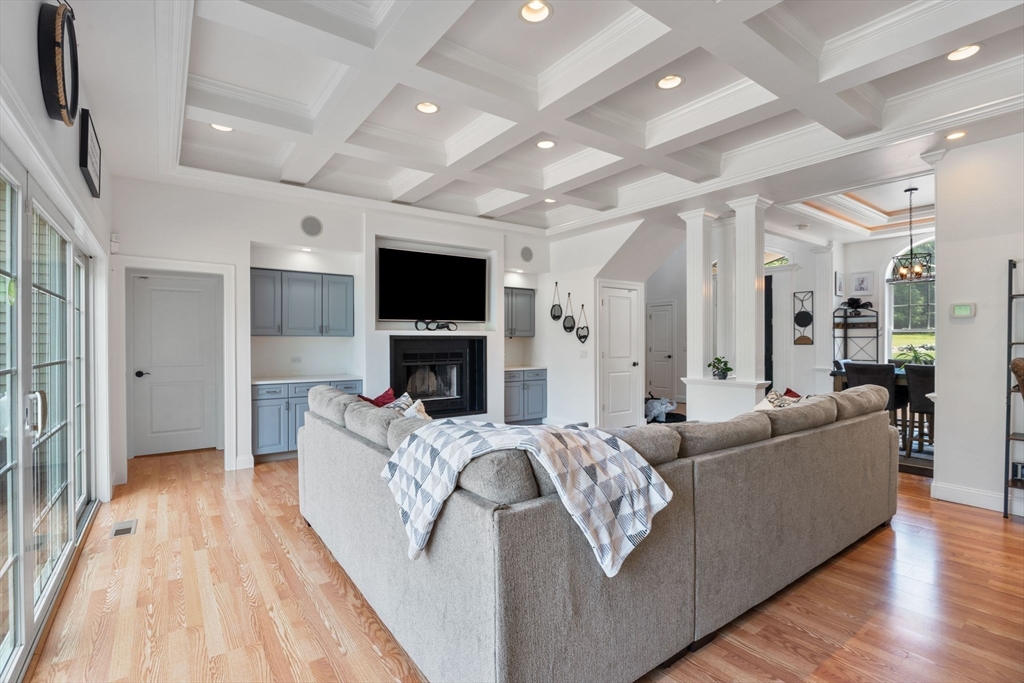 31 Cedar Street North Reading, MA 01864 - Photo 7 of 41 a living room with furniture and a flat screen tv