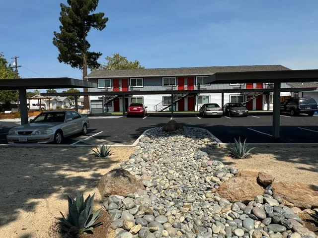 a view of a car park in front of a building