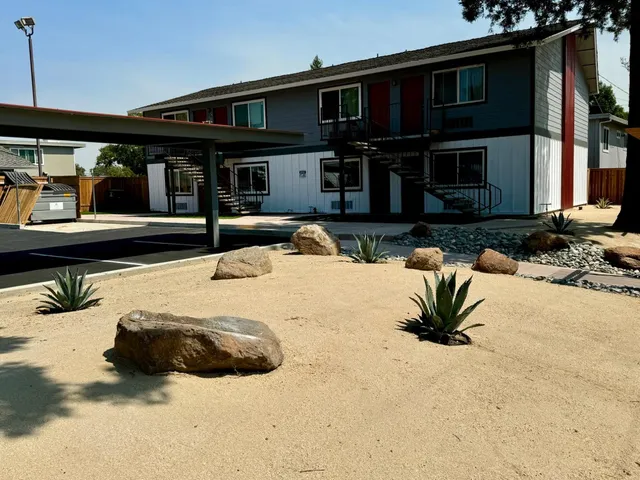 a view of a house with snow on the road