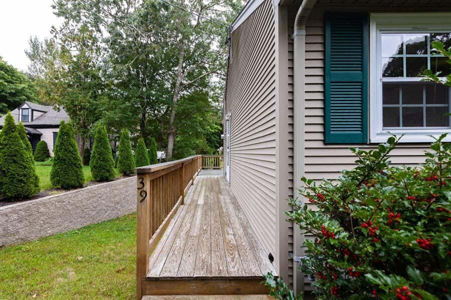39 Nickerson Road Cotuit, MA 02635 - Photo 14 of 24 a backyard of a house with seating space