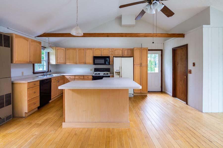 39 Nickerson Road Cotuit, MA 02635 - Photo 3 of 24 a kitchen with a sink appliances and cabinets
