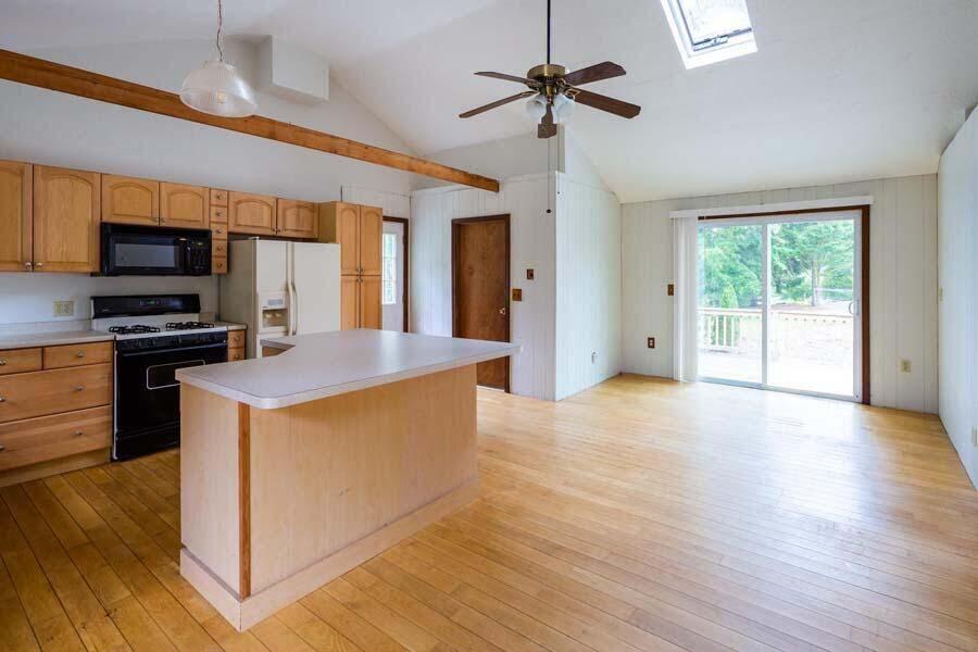39 Nickerson Road Cotuit, MA 02635 - Photo 4 of 24 a large kitchen with stainless steel appliances granite countertop a stove and a wooden floors