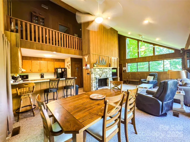 a view of a hallway with furniture and windows