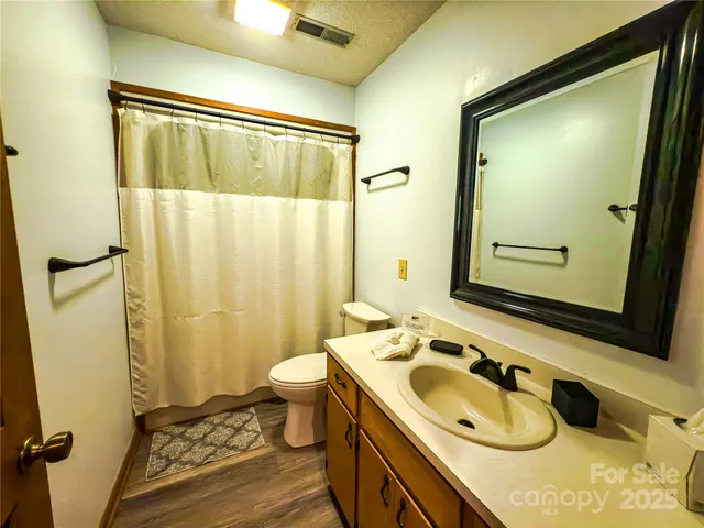 a living room with furniture fireplace and a table