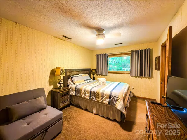 a view of a house with swimming pool and sitting area
