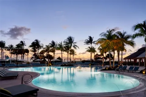 a view of a swimming pool with a table and chairs