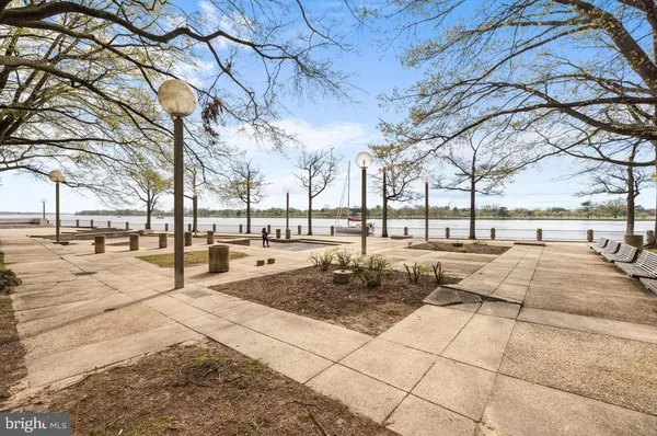 a swimming pool with outdoor seating