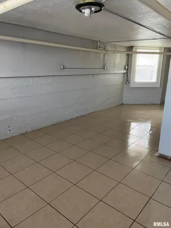 a view of a window and an empty room