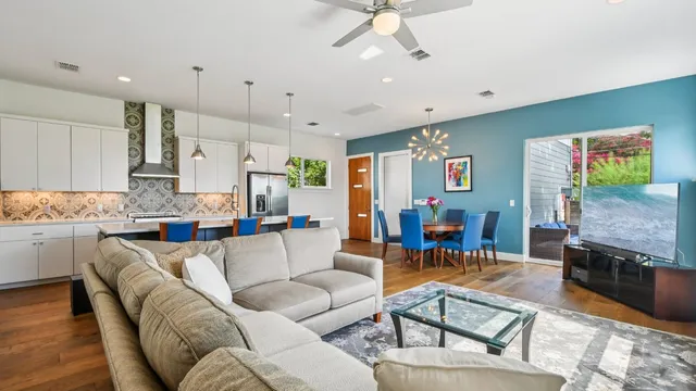 a living room with fireplace furniture and a flat screen tv