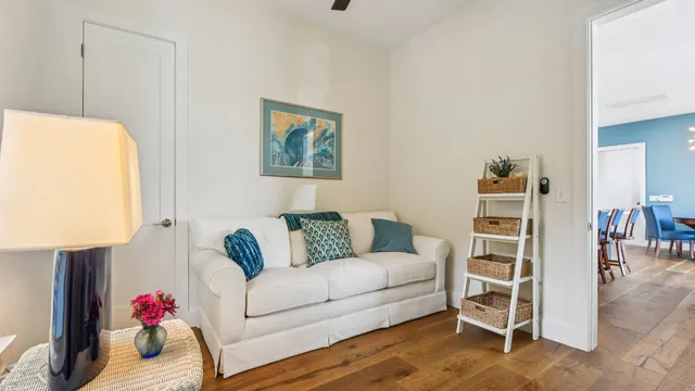 a living room with furniture and a bed