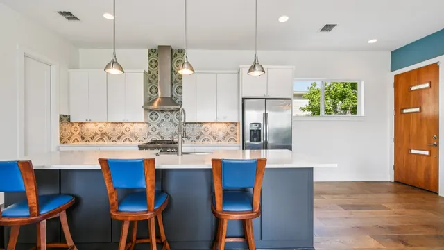 a dining table chairs and a chandelier