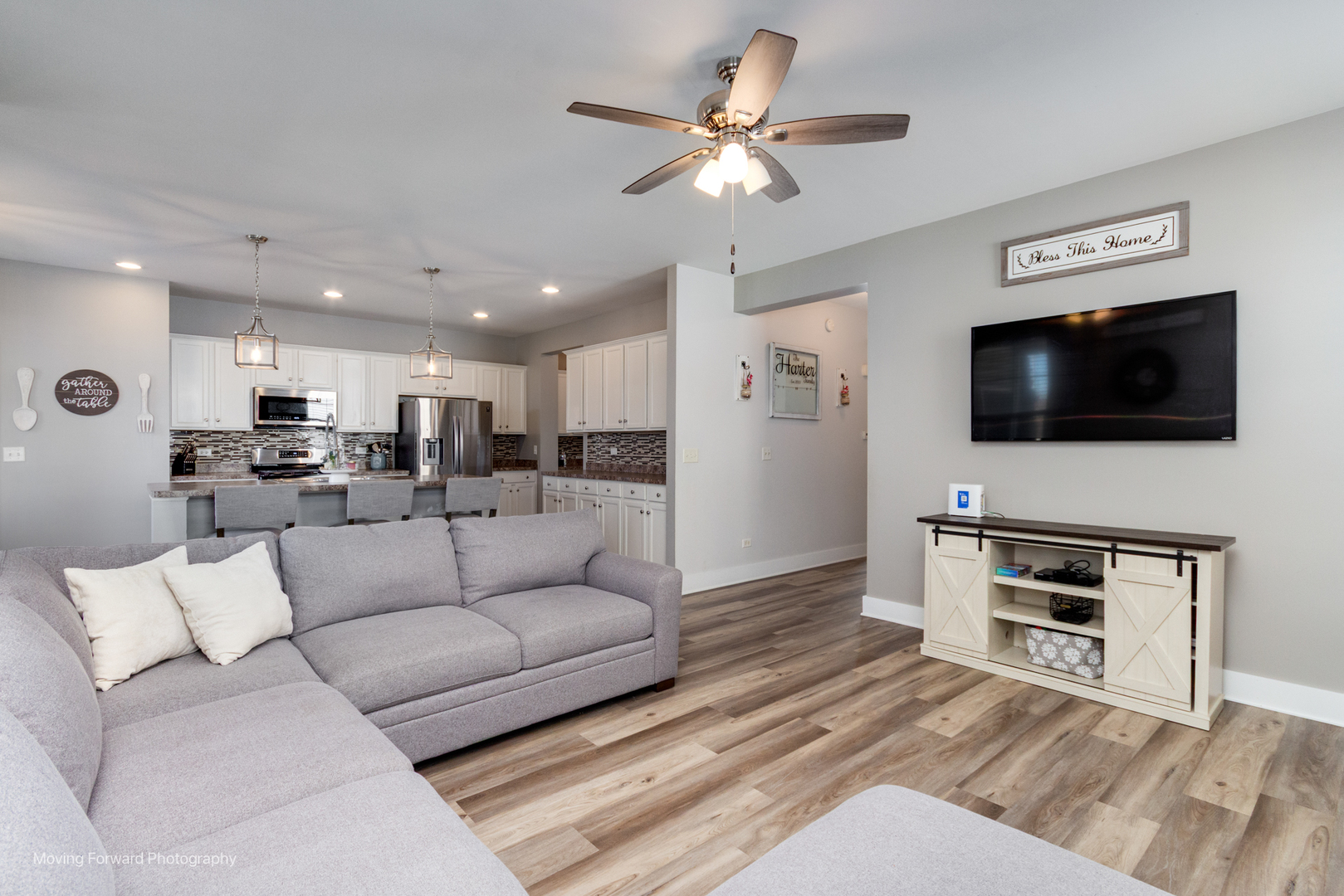 25420 Springview Court Plainfield, IL 60586 - Photo 11 of 26 a living room with furniture and a flat screen tv