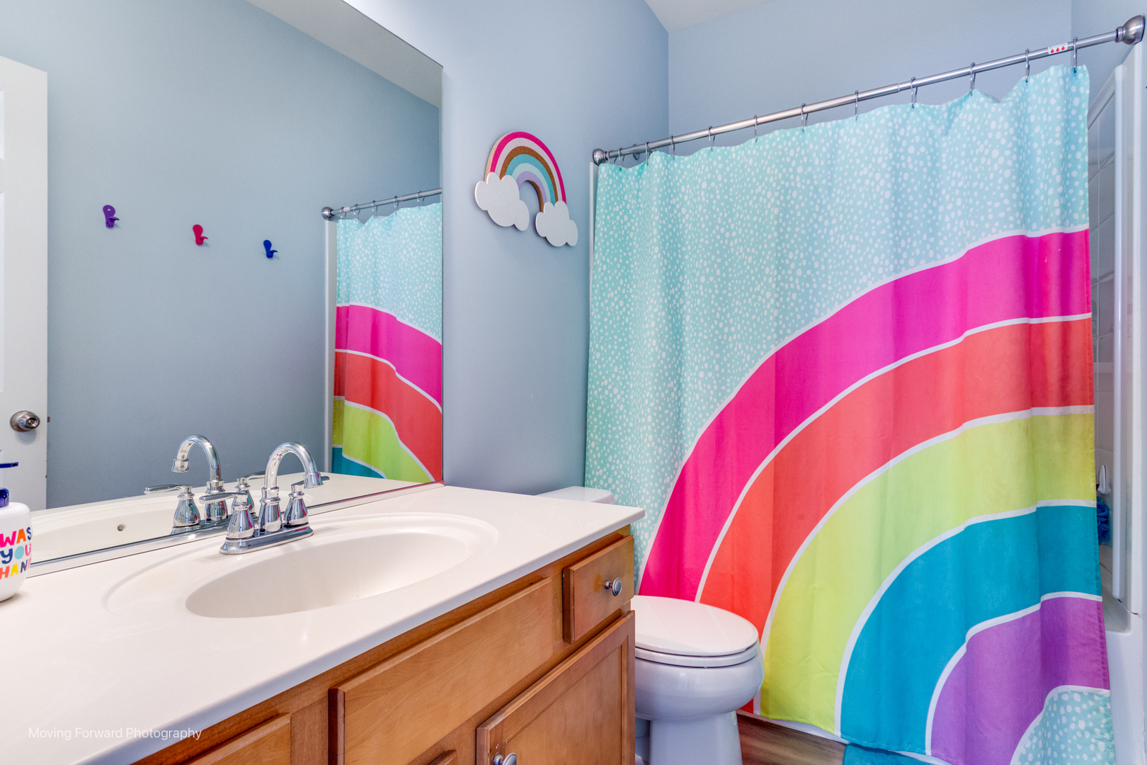 25420 Springview Court Plainfield, IL 60586 - Photo 18 of 26 a bathroom with a sink vanity mirror and toilet