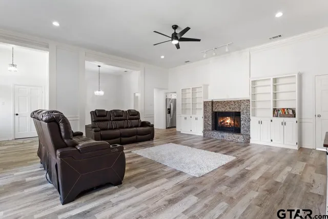 a living room with furniture and a fireplace