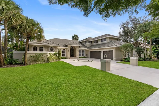 a front view of a house with a garden and porch