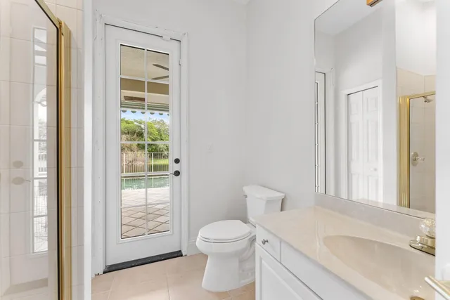 a large white kitchen with lots of counter top space
