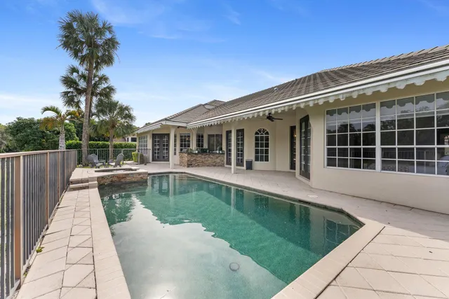 an aerial view of residential houses with yard