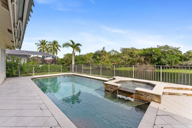 a view of a tennis ground with a large pool