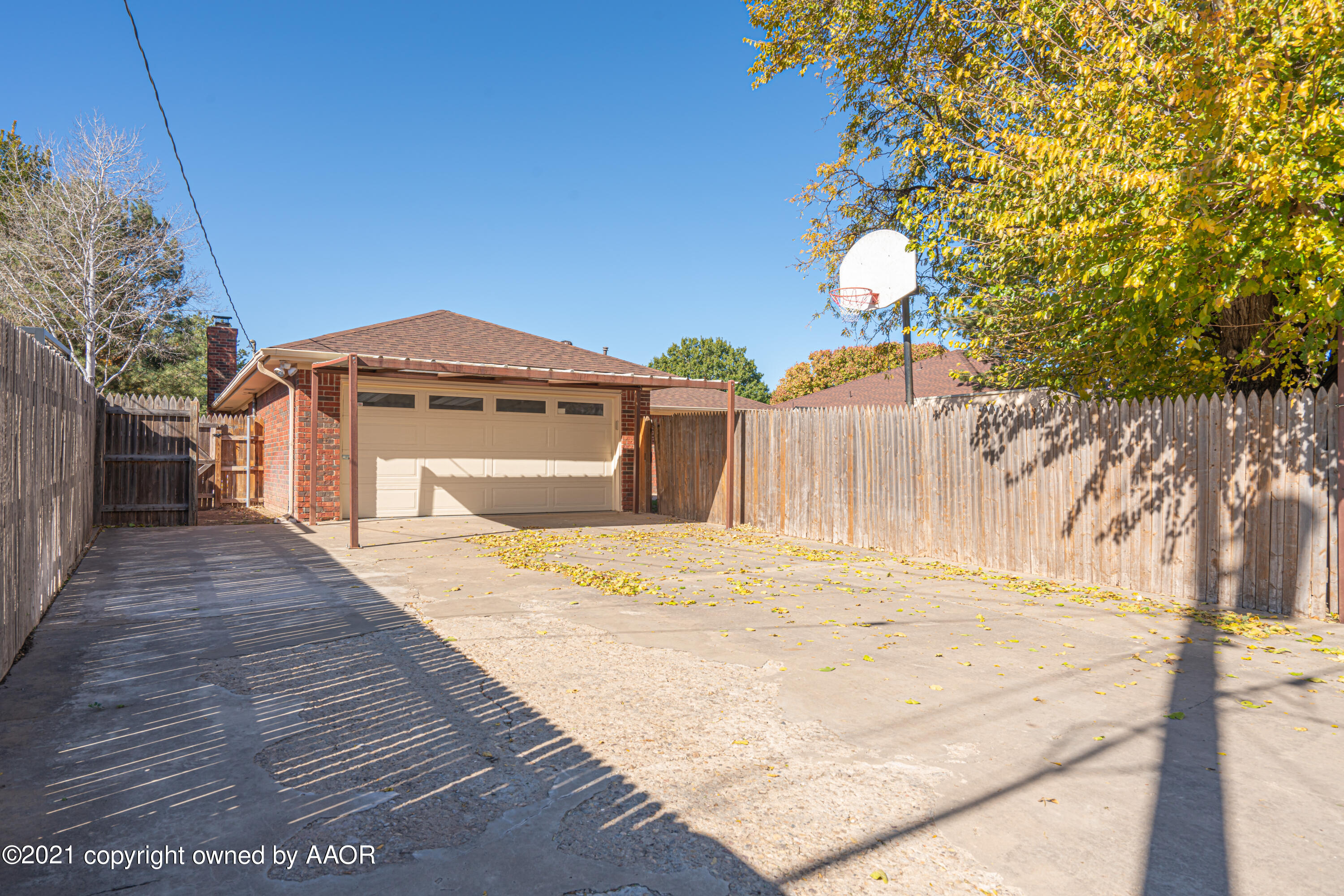 5811 Hardwick Drive Amarillo, TX 79109 - Photo 2 of 24 a front view of a house with a yard and garage