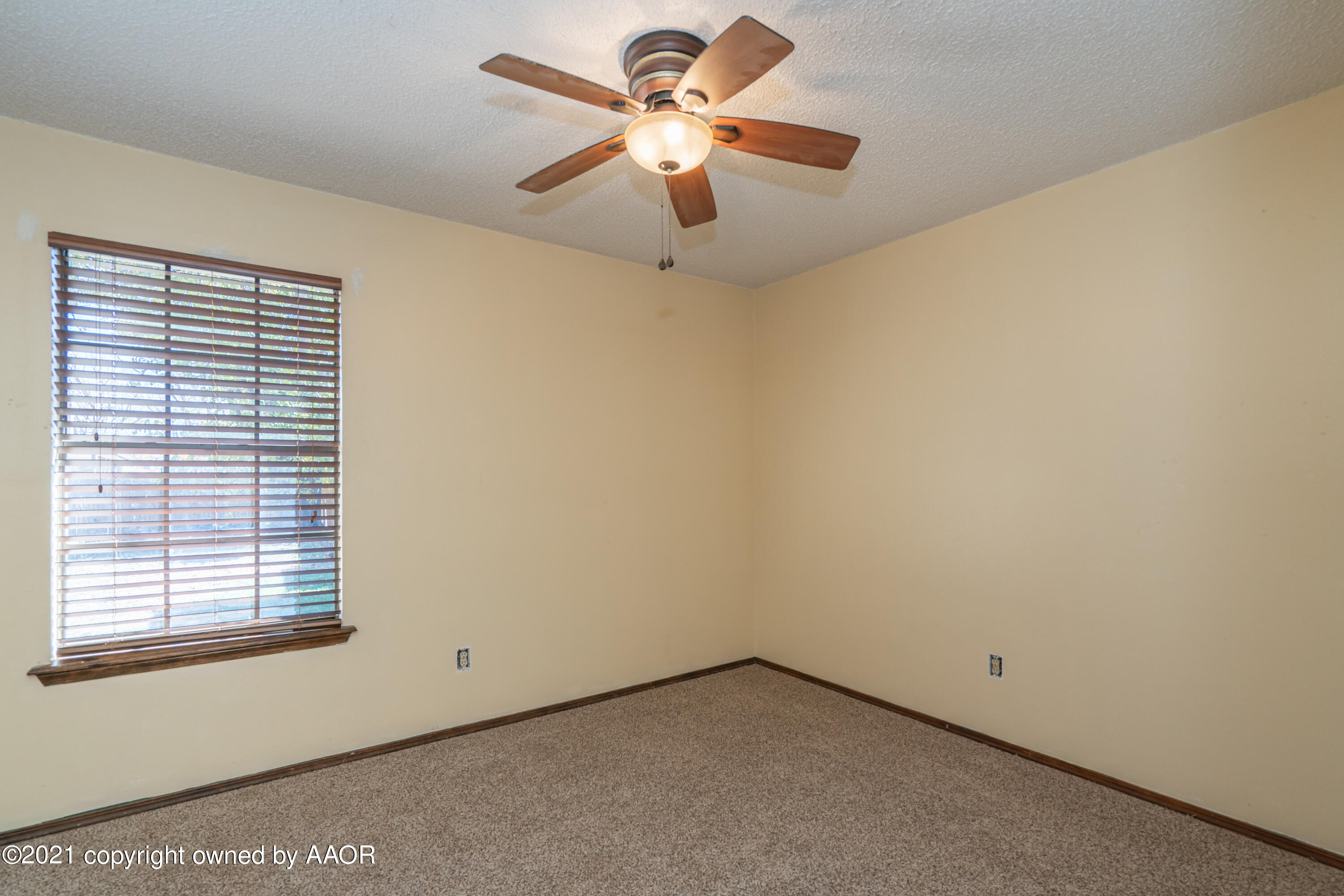 5811 Hardwick Drive Amarillo, TX 79109 - Photo 12 of 24 a view of room with a ceiling fan and window