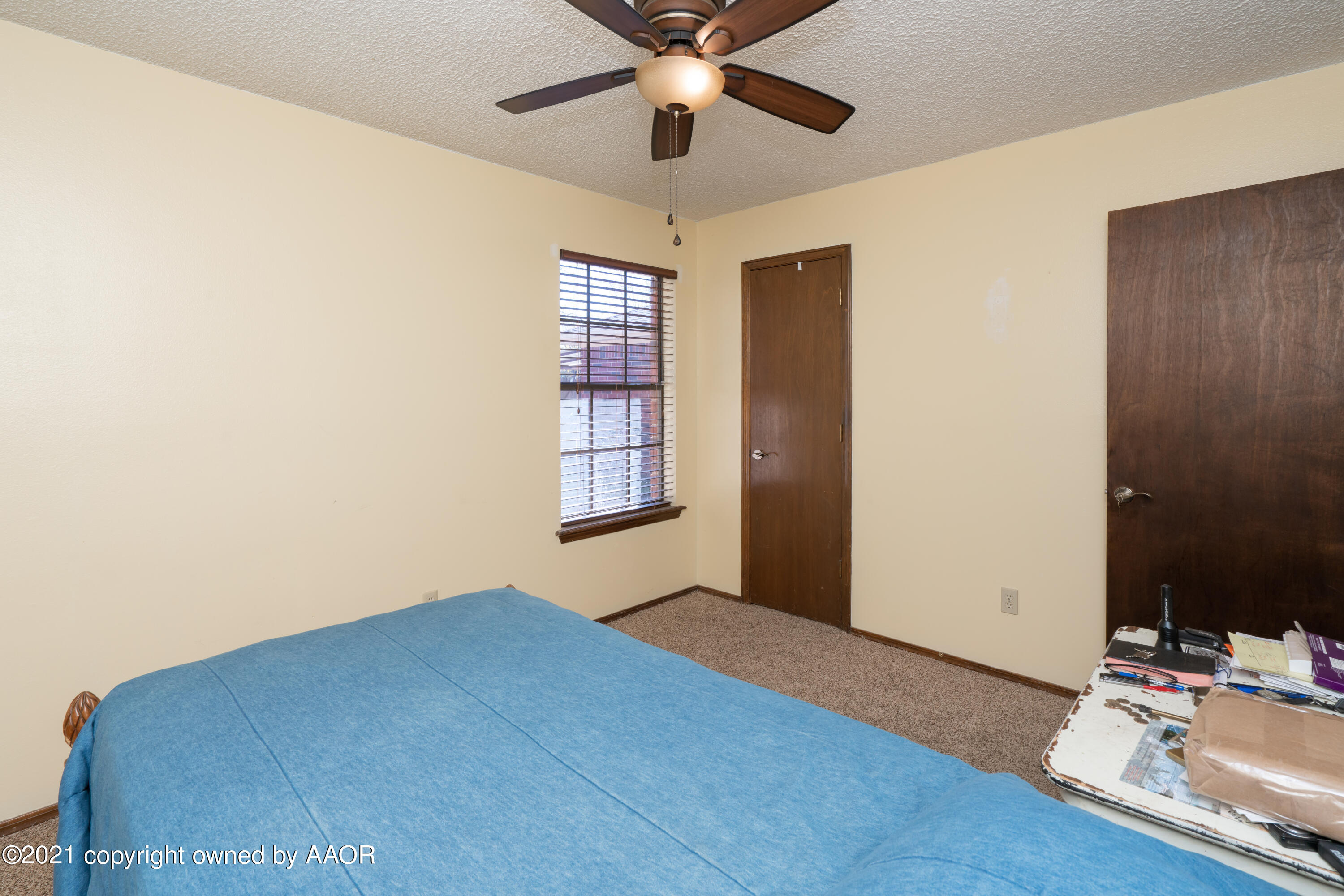 5811 Hardwick Drive Amarillo, TX 79109 - Photo 20 of 24 a bedroom with bed and window