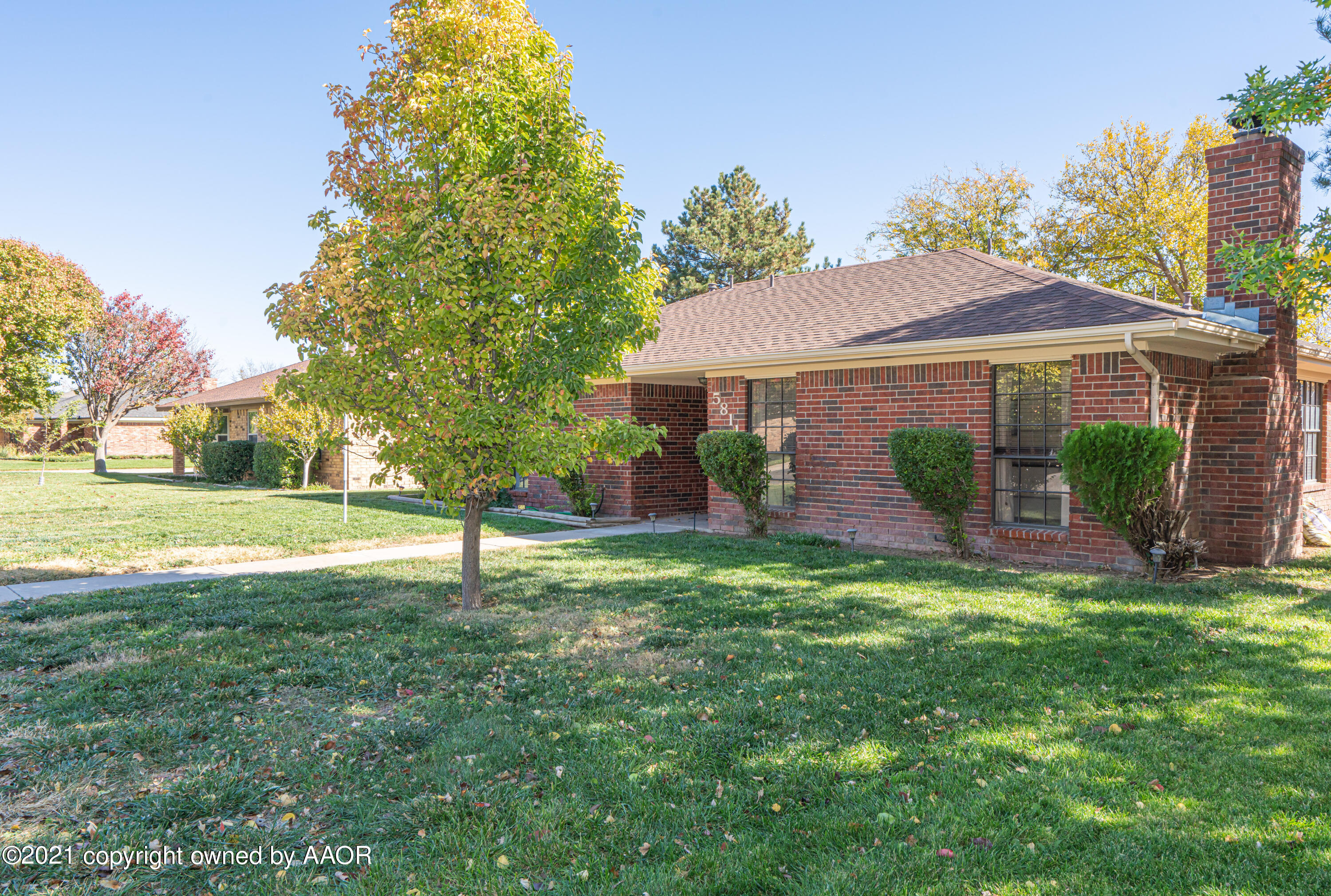 5811 Hardwick Drive Amarillo, TX 79109 - Photo 3 of 24 a view of a house with a yard and a garden