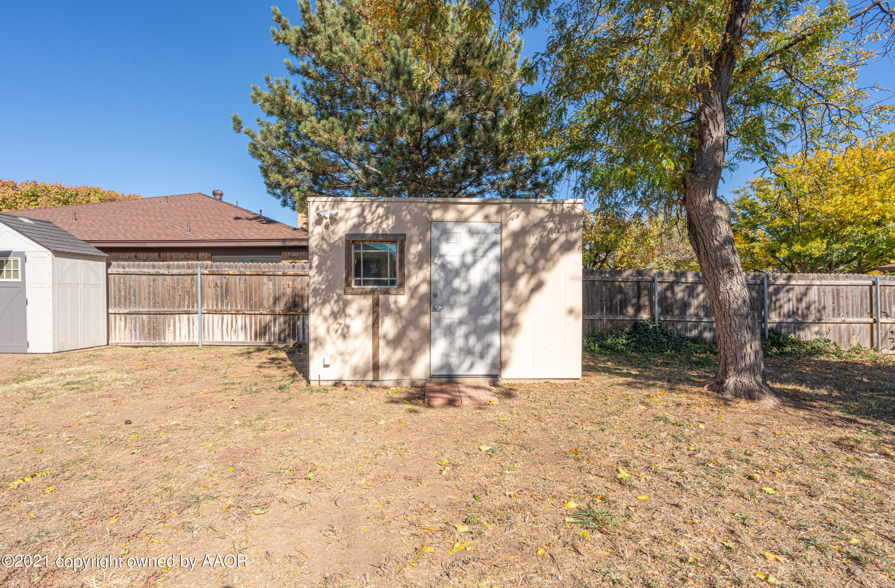 5811 Hardwick Drive Amarillo, TX 79109 - Photo 22 of 24 a front view of a house with a yard
